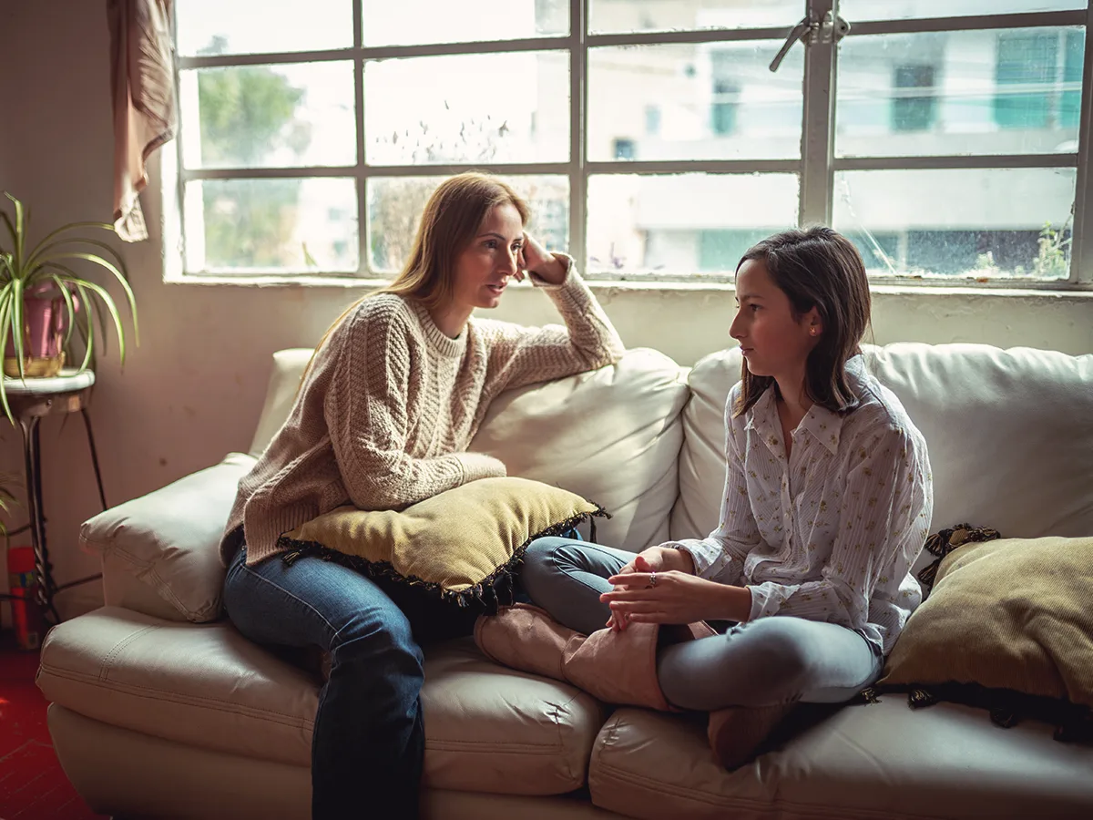 How to get your child to talk about school, mom talking to daughter at home